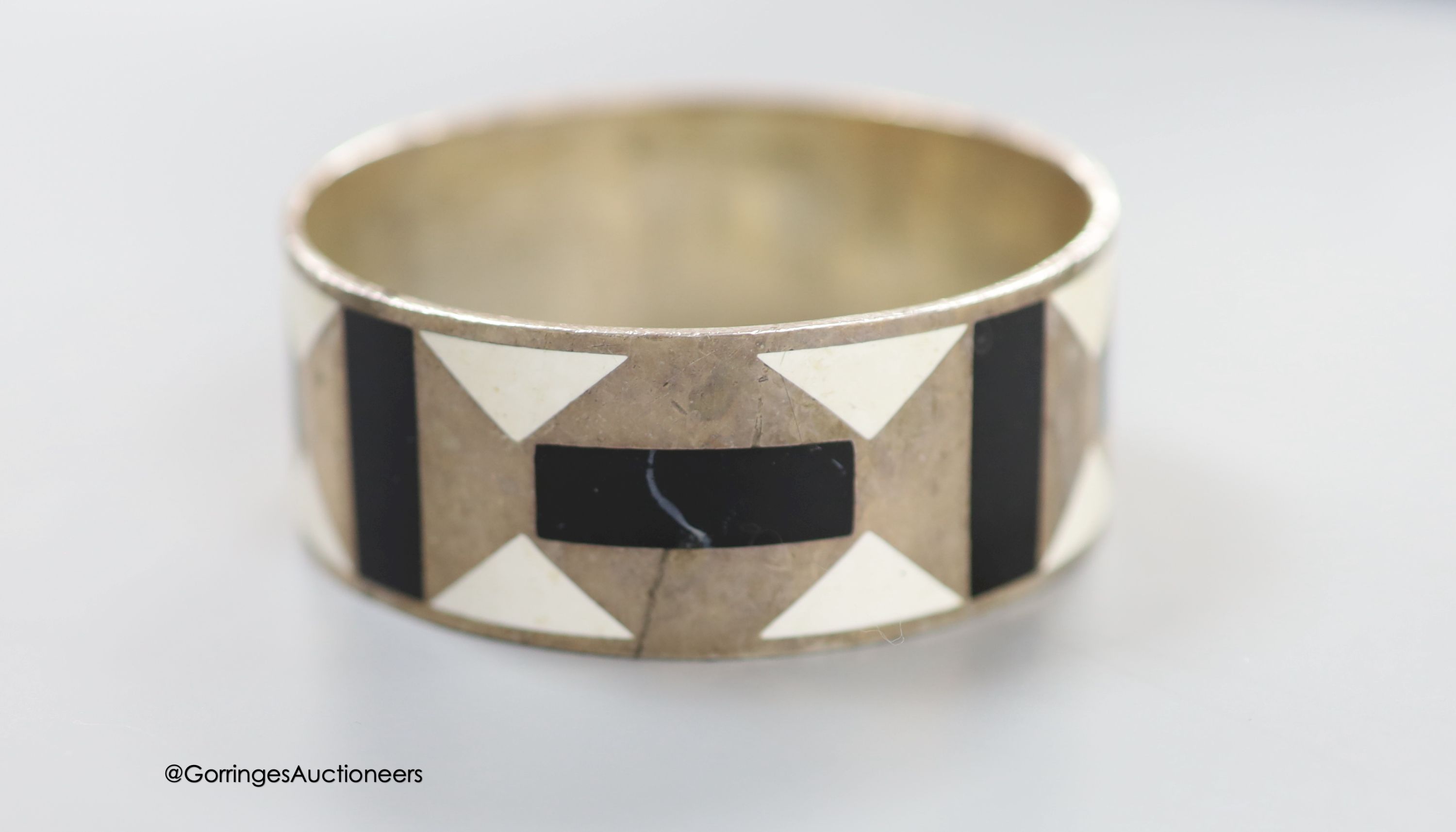 A modern Paloma Picasso for Tiffany & Co 925 and two colour enamel bangle, interior diameter approx. 62mm, gross weight 72.9 grams (a.f.).